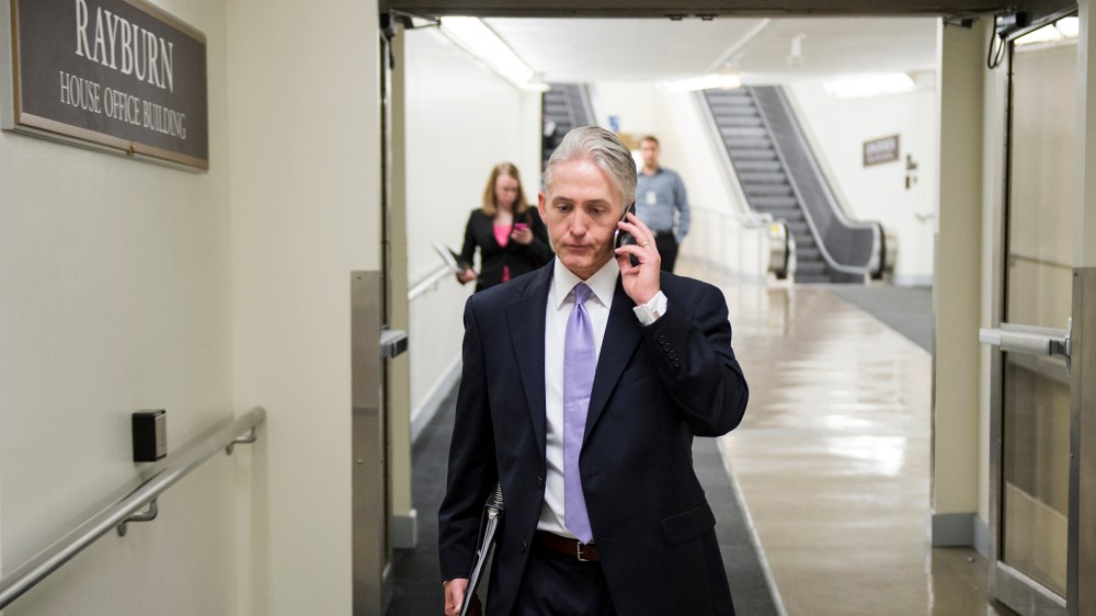 Rep. Trey Gowdy, R-S.C., chair of the newly formed select committee to investigate the State Department's handling of the 2012 attack in Benghazi, speaks on his phone as he walks to the Rayburn House Office Building, May 7, 2014.