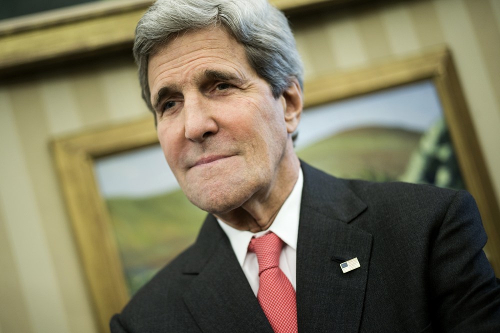 US Secretary of State John Kerry waits for a meeting in the Oval Office of the White House on May 12, 2014 in Washington, DC.