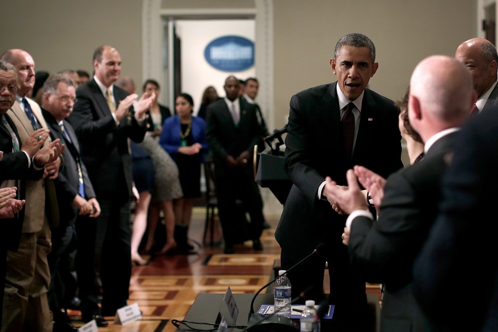 U.S. President Barack Obama greets law enforcement leaders from across the country after speaking to them in the Eisenhower Executive Office Building on May 13, 2014 in Washington, DC.