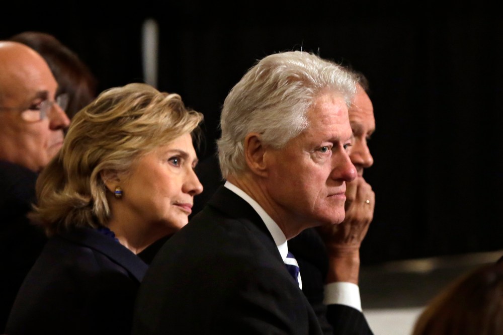 Bill and Hillary Clinton listen to ceremonies during the National September 11 Memorial Museum dedication ceremony on May 15, 2014 in New York City.