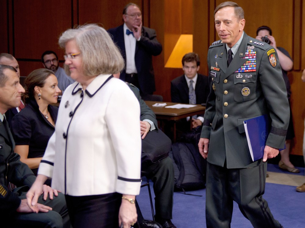 File Photo: A June 23, 2011 photo shows Paula Broadwell (2nd L) watching as General David Petraeus (R) and his wife Holly Petraeus (3rd L) arrive for a Senate Select Intelligence Committee hearing on Petraeus' nomination to be director of the Central...