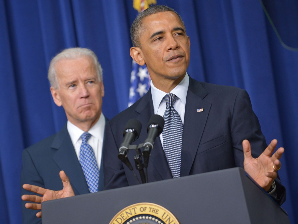 US President Barack Obama speaks on proposals to reduce gun violence as Vice President Joe Biden watches on January 16, 2013 in the South Court Auditorium of the Eisenhower Executive Office Building, next to the White House in Washington, DC. President...