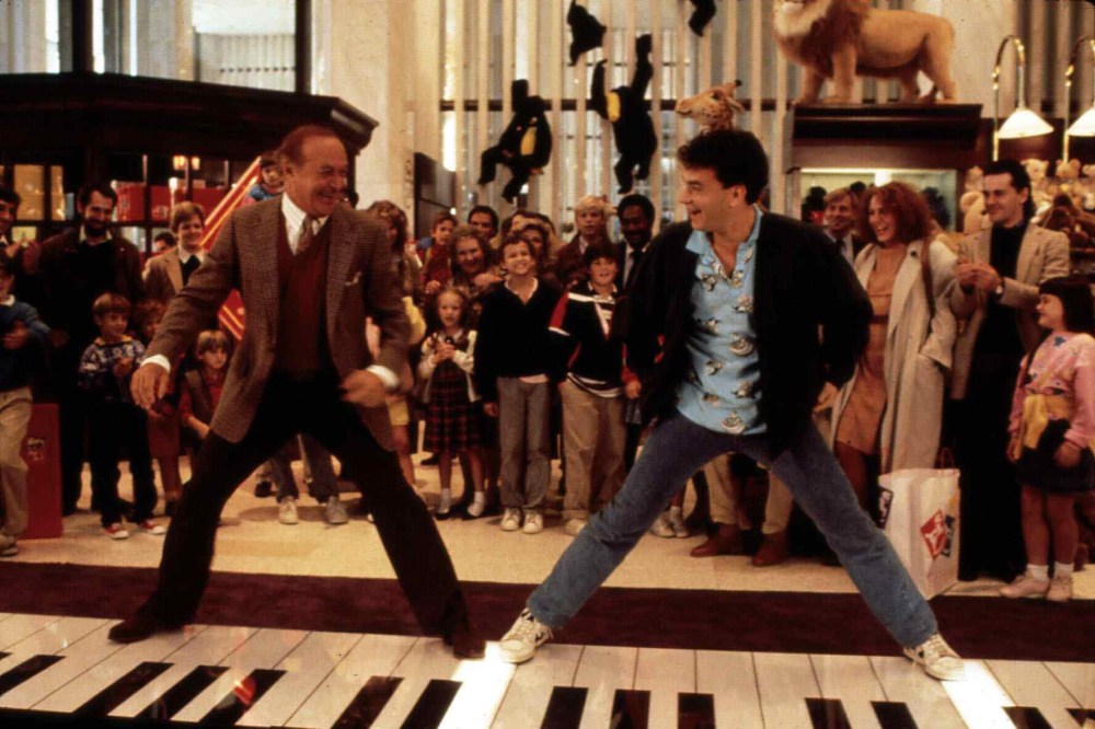 Robert Loggia, left, and Tom Hanks stand on a giant piano keyboard at the FAO Schwartz toy store in a still from the film 'Big' directed by Penny Marshall. (Photo by United Archives/ullstein bild/Getty)