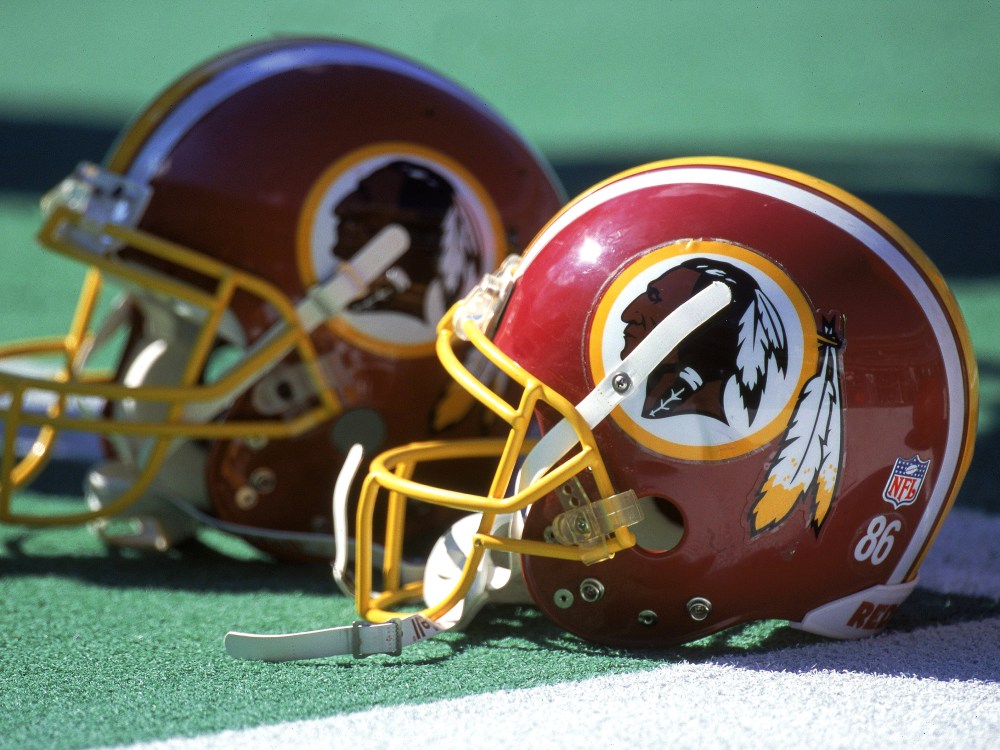 Washington Redskins helmets (Photo by Doug Pensinger/Allsport via Getty Images)