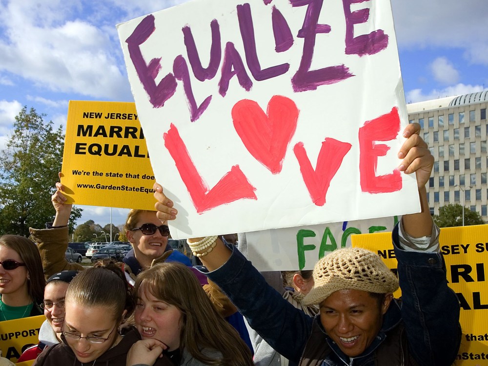 File Photo: Supporters await the New Jersey Supreme court decision on same-sex marriage in front of the Supreme court building October 25, 2006 in Trenton, New Jersey. New Jersey's highest court guaranteed gay couples the same rights as married...