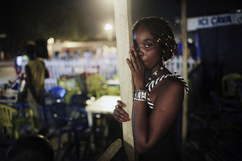An unidentified sex worker looks for customers at bar late at night in the Bon Marche district in central Kinshasa, Congo, DRC. (Photo by Per-Anders Pettersson/Getty Images)