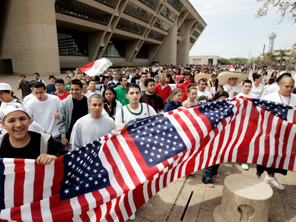 File Photo: Thousands of high school students march in front of city hall in Dallas, Tuesday, March 28, 2006. Thousands of students walked out of class and converged on City Hall to protest immigrant legislation in Congress. (Photo by AP Photo/Tony...