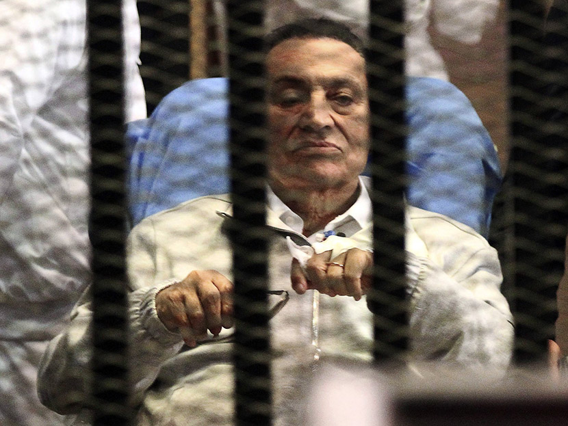 Image: File picture shows Egypt's ousted President Mubarak sitting inside a dock at the police academy on the outskirts of Cairo