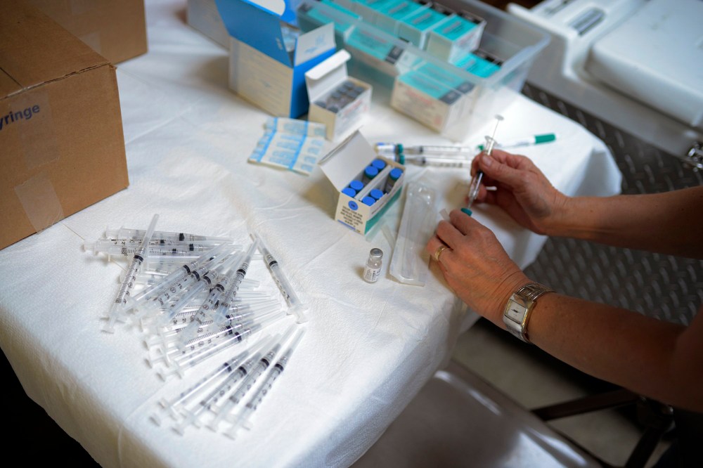 A public health nurse with the Knox County Health Department prepares to administer the measles, mumps and rubella (MMR) vaccine during an immunization clinic on May 28, 2014. (Photo by Noah Addis for NBC News)