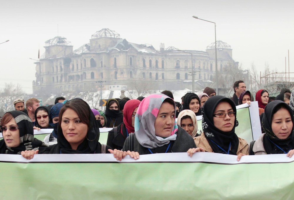 Dozens of Afghan activists marked Valentines Day by marching in Kabul to denounce violence against women. As the U.S. prepares to withdraw, Afghan women fear their rights will disappear. (AP Photo/Musadeq Sadeq)