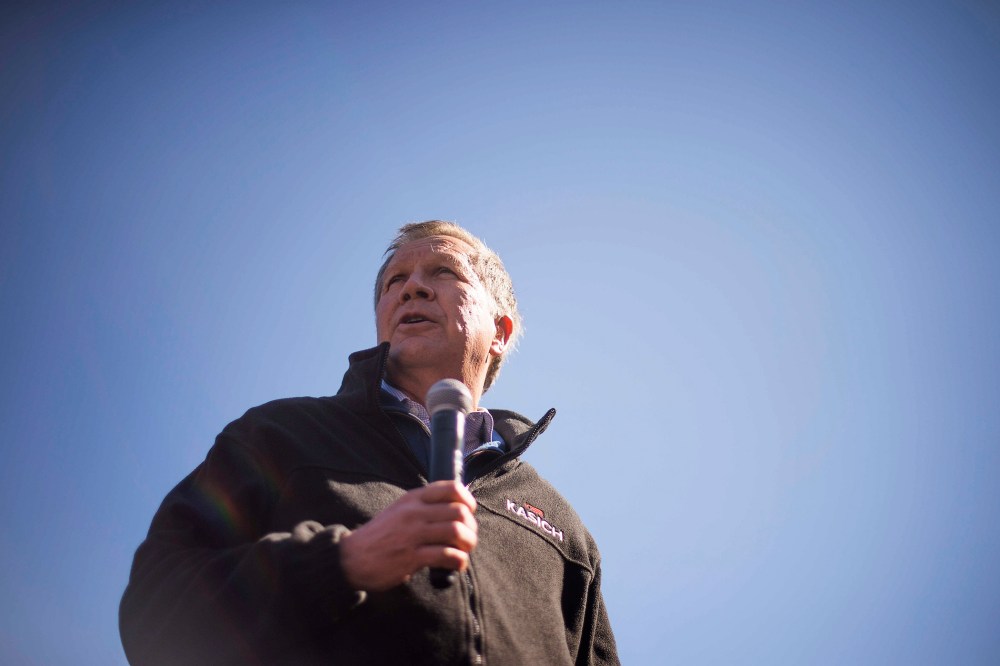 Republican presidential candidate John Kasich speaks outside Mutt's BBQ in Mauldin, S.C., on Feb. 13, 2016. (Photo by Jim Watson/AFP/Getty)