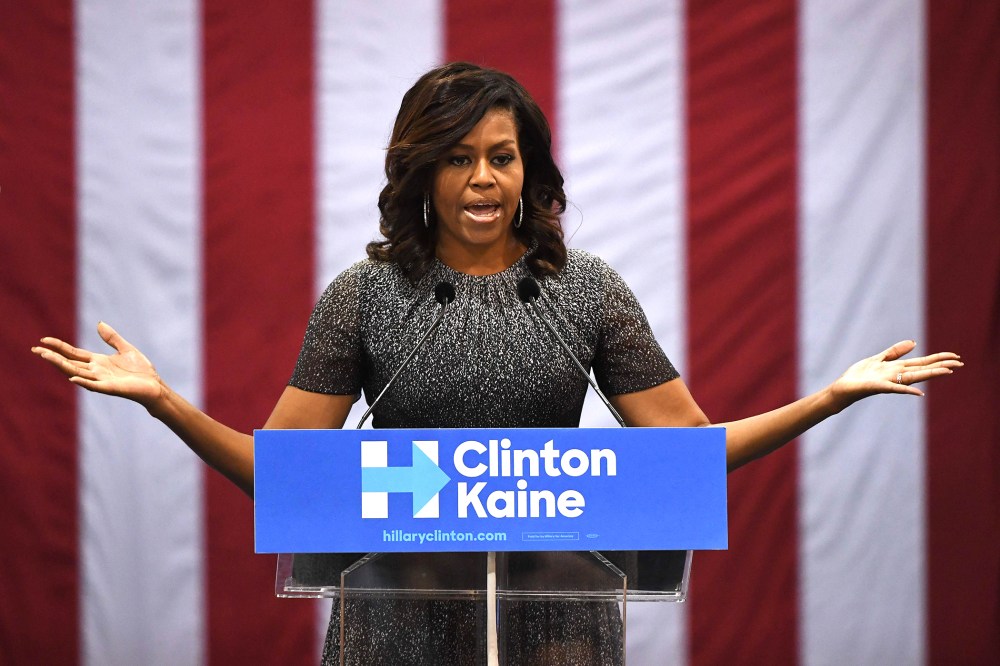 First Lady Michelle Obama speaks to a crowd of supporters as she campaigns for the Democratic Party presidential nominee Hillary Clinton at the Convention Center, in Phoenix, Ariz., on Oct. 20, 2016. (Photo by Mark Ralston/AFP/Getty)