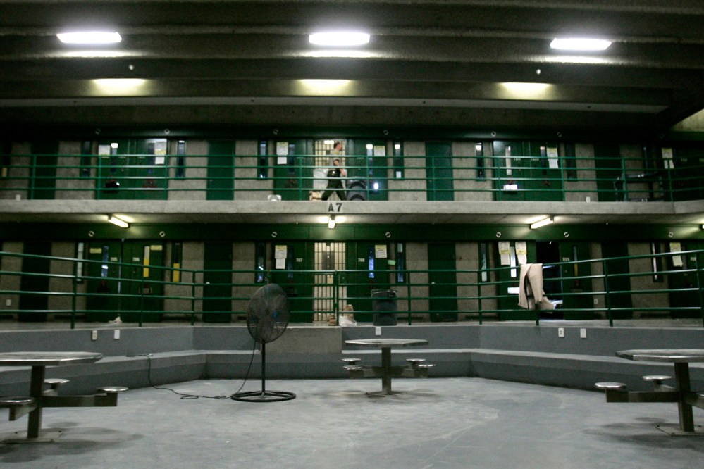 Correctional Officer Max Nelson makes the rounds, every 30 minutes, checking on inmates in the segregation unit for suicide attempts, at California State Prison, Sacramento, in Folsom, Calif., March 30, 2007. (Photo by Rich Pedroncelli/AP)