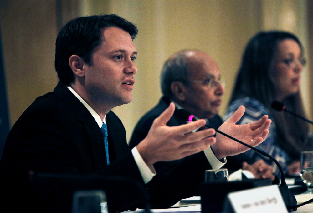 Senator Jason Carter, left, talks during a press conference for the Carter Center's election witnessing mission in Egypt, in Cairo, Egypt, Tuesday, June 19, 2012.