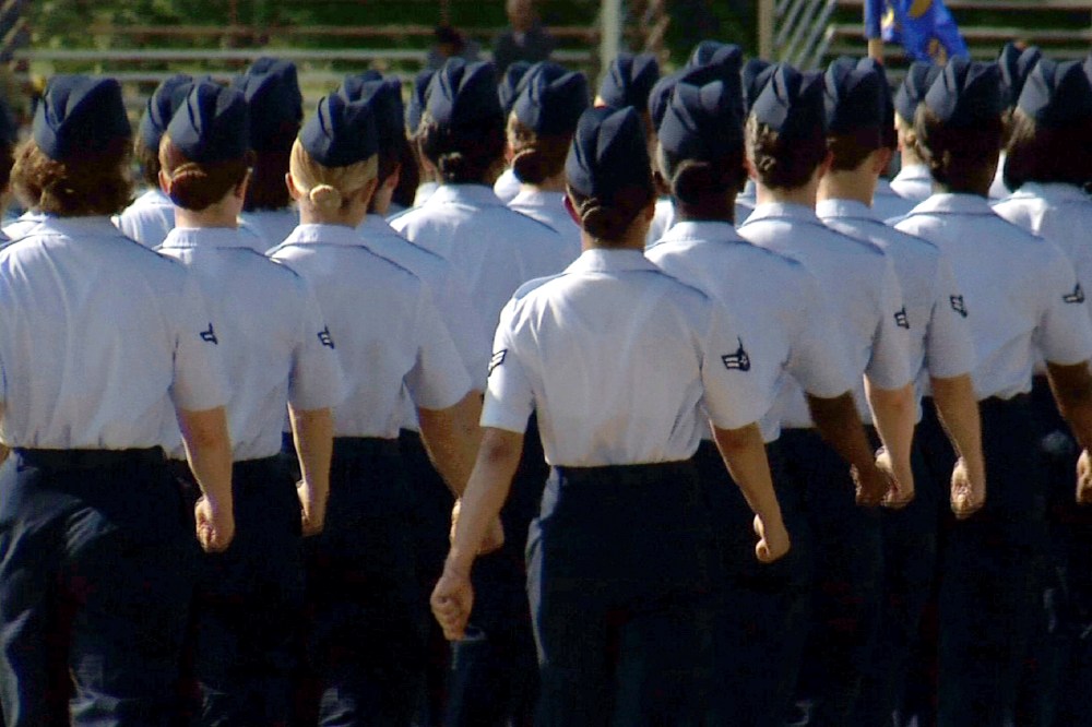 In this June 22, 2012, image made from video, female airmen march during graduation at Lackland Air Force Base in San Antonio, Texas. (Photo by John L. Mone/AP)