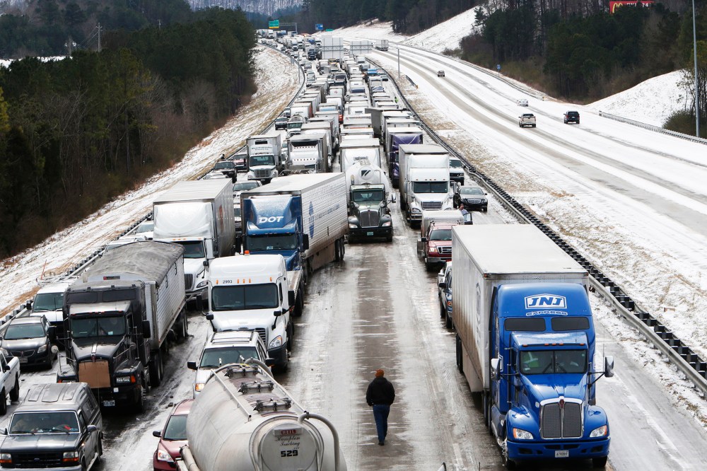 Traffic is at a standstill on Interstate 65 northbound as officials work to clear abandoned vehicles in Hoover, Ala. Jan. 29, 2014.