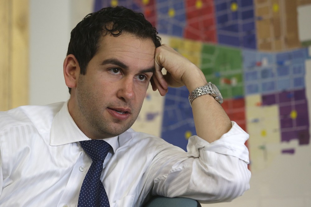 In this Friday, March 15, 2013 photo, Steven Fulop talks to The Associated Press at his campaign headquarters in Jersey City, N.J.