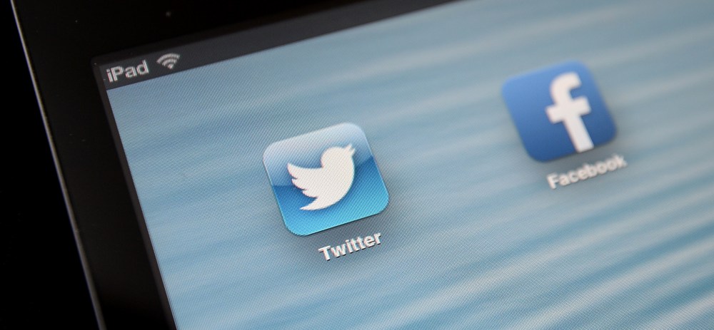 General Stock - Twitter. General view of the Twitter app icon next to the Facebook app icon being viewed on an iPad. Picture date: Tuesday July 30, 2013. Photo credit should read: Andrew Matthews/PA Wire URN:17192998