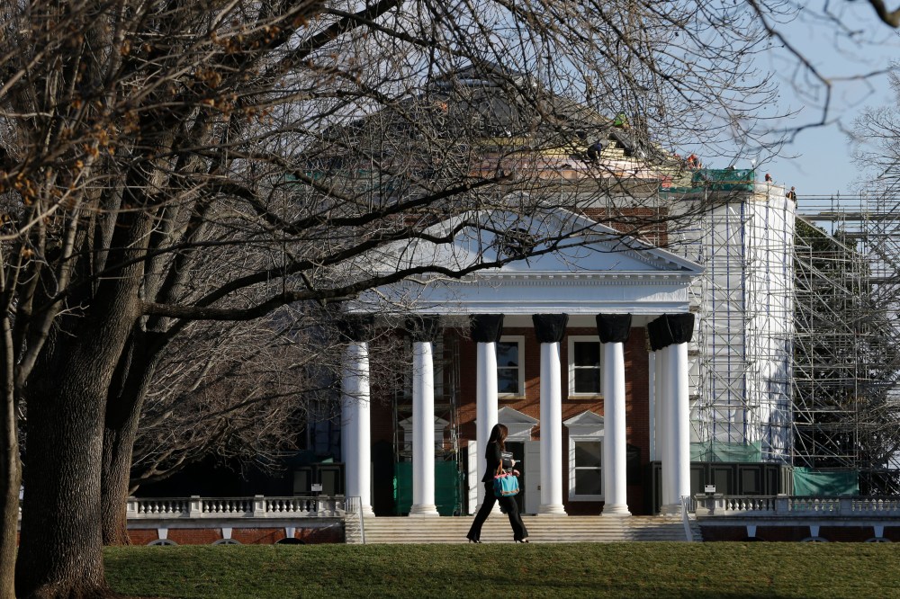 A student walks across the Lawn in front of the Rotunda at the University of Virginia Wednesday on Feb. 20, 2013 in Charlottesville, Va. (Steve Helber/AP)