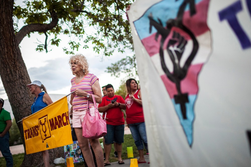 In this May 29, 2014 photo, Denee Mallon, second from left, takes part in the Trans March to Morningside Park in Albuquerque, N.M.