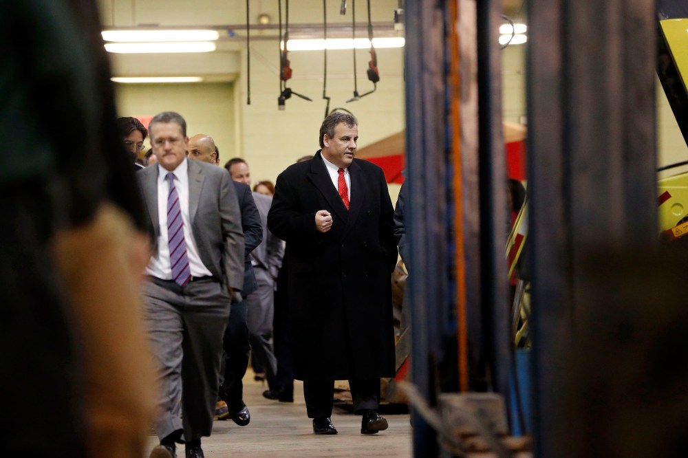 New Jersey Gov. Chris Christie leaves a boardroom at the Newark Department of Transportation after hearing a briefing ahead of a snowstorm, Jan. 22, 2016, in Newark, N.J. (Photo by Julio Cortez/AP)