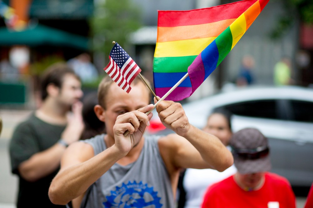 A man demonstrates outside the Miami court house during the court hearing on gay marriage in Miami, Fla. on July 2, 2014. (J Pat Carter/AP)
