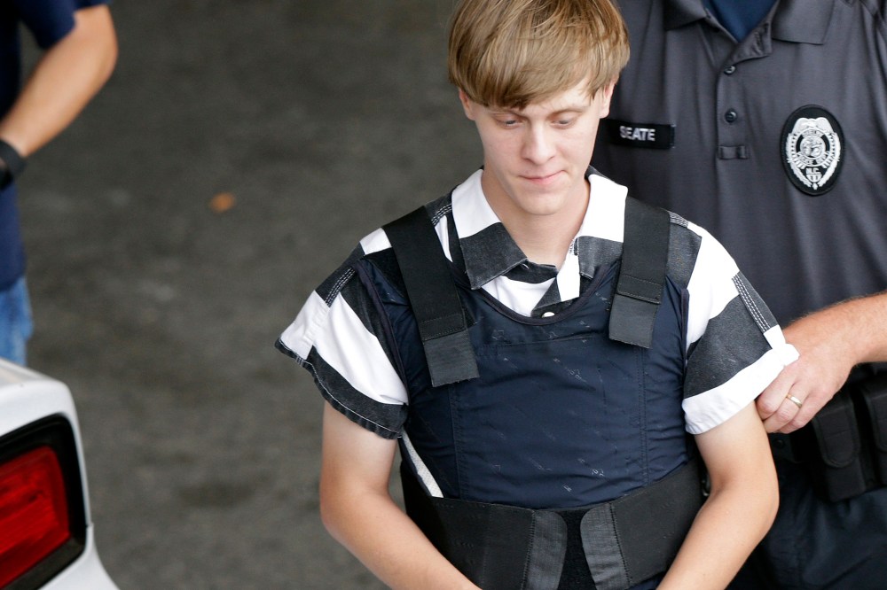 Dylann Storm Roof is escorted from the Cleveland County Courthouse in Shelby, N.C. on June 18, 2015. (Photo by Chuck Burton/AP)
