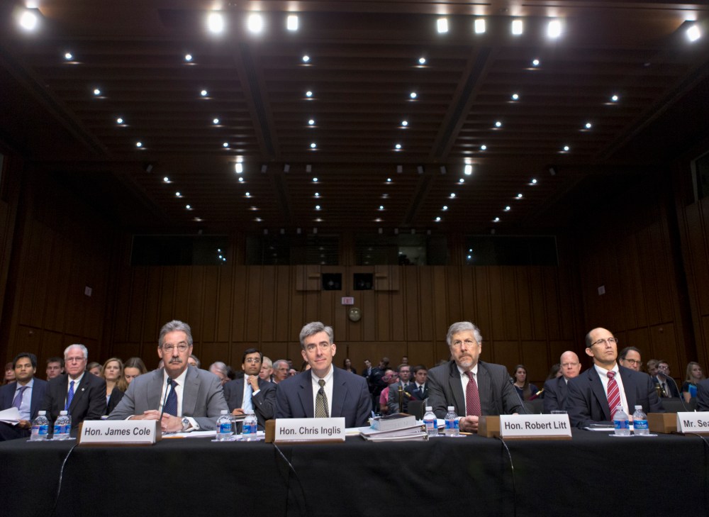 From left, Deputy Attorney General James Cole; National Security Agency Deputy Director John C. Inglis; Robert Litt, general counsel in the Office of Director of National Intelligence; and Sean Joyce, deputy director of the FBI, wait to testify on...