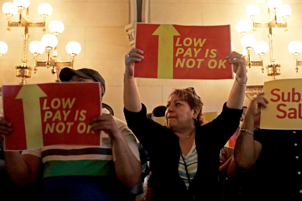 Protesters advocate for a raise in the minimum wage at the Capitol on Tuesday, June 17, 2014, in Albany, N.Y.