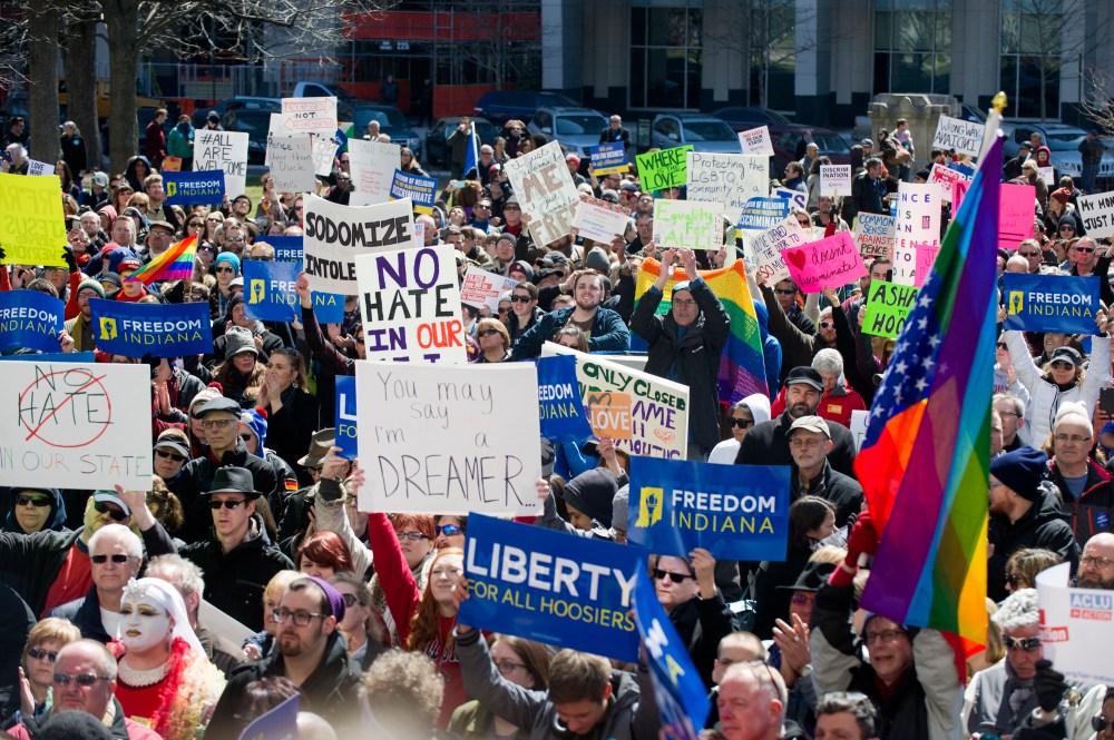 Thousands of opponents of Indiana Senate Bill 101, the Religious Freedom Restoration Act, gathered on the lawn of the Indiana State House to rally against that legislation, March 28, 2015. (Photo by Doug McSchooler/AP)