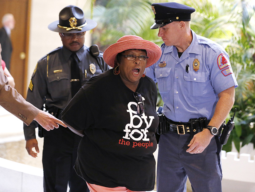 Demonstrators are arrested during "Moral Monday" demonstrations at the North Carolina Legislative Building in Raleigh, N.C., Monday, July 22, 2013. (Photo by Ethan Hyman/The News & Observer/AP)