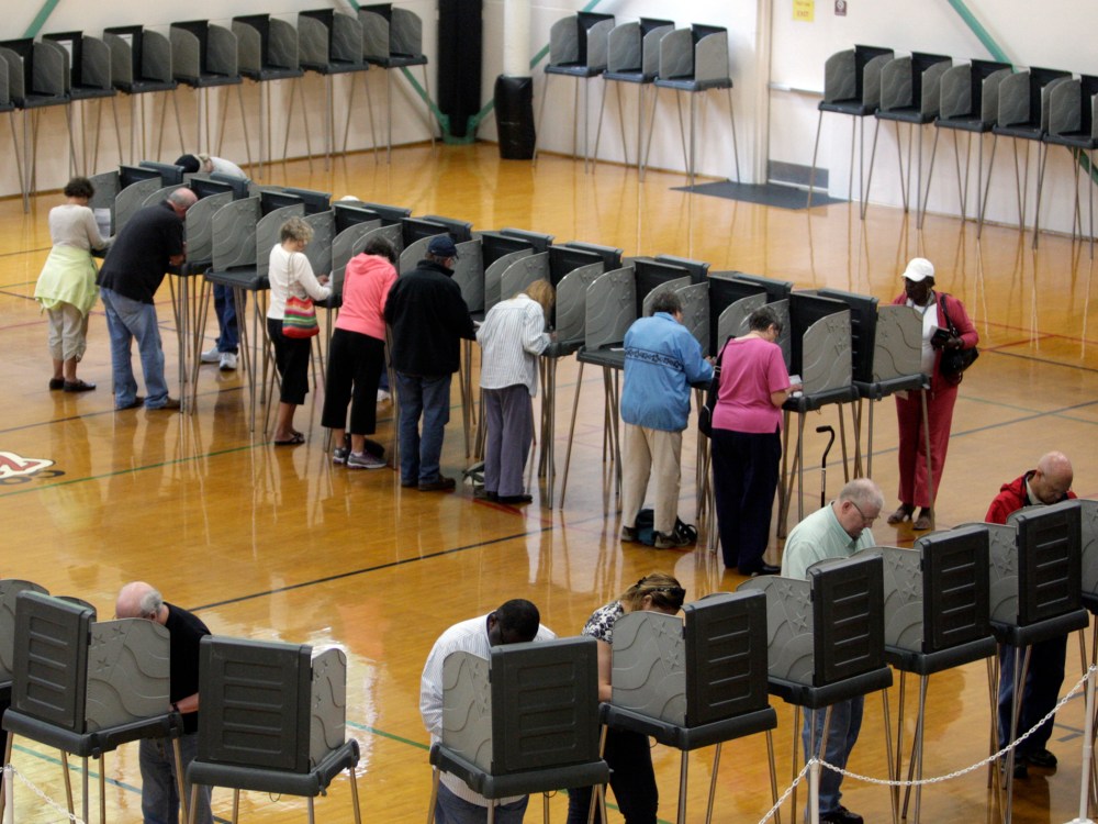 File Photo: Voters cast their ballots at the Herbert Young Community Center polling place in Cary, N.C.. on Thursday, Oct. 18, 2012, the first day of early voting in North Carolina. (Photo by Shawn Rocco/The News & Observer/AP Photo, File)