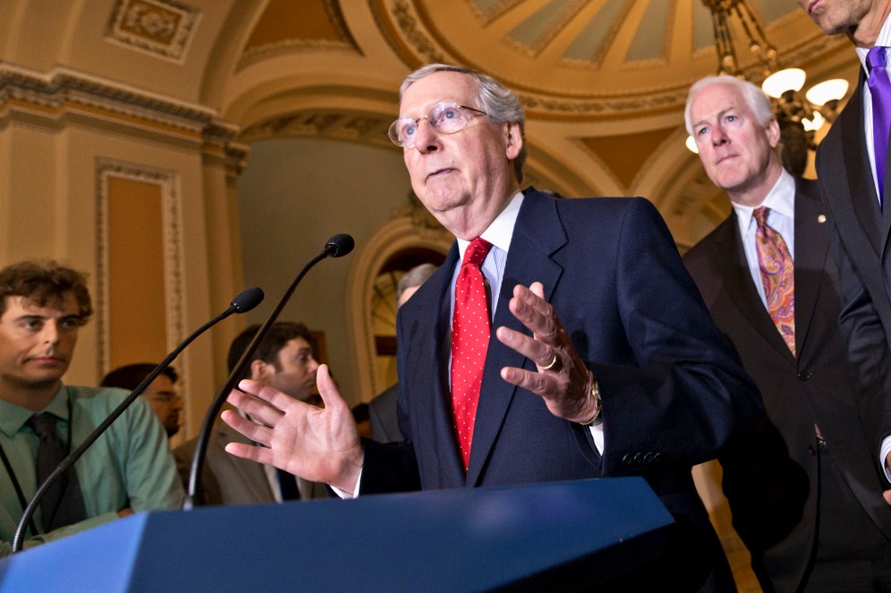 Senate Minority Leader Mitch McConnell of Ky., left, accompanied by Senate Minority Whip John Cornyn of Texas, center, and Sen. John Thune, R-S.D., Senate Republican Conference chairman, talks about the startup problems of the Affordable Care Act as they
