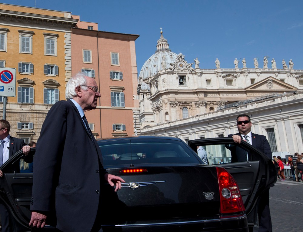 U.S. presidential candidate Bernie Sanders, backdropped by the dome of St. Peter's Basilica, at the Vatican, April 16, 2016. (Photo by Alessandra Tarantino/AP)