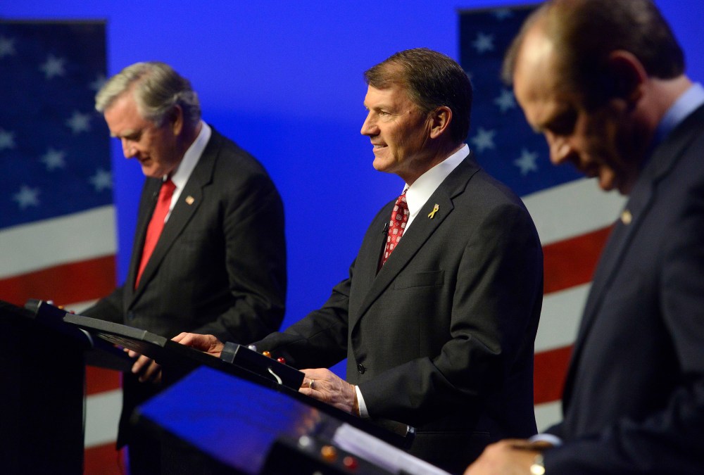 Independent candidate, Larry Pressler, left, Republican candidate, Mike Rounds, center and Democratic candidate Rick Weiland prepare before a televised U.S. Senate candidate debate Thursday night, on Oct. 23, 2014 in Vermillion, S.D.