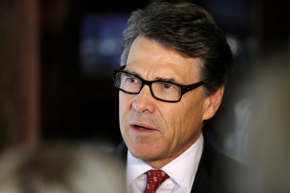 Texas Gov. Rick Perry speaks to reporters following an event, May 29, 2014, in Ames, Iowa.