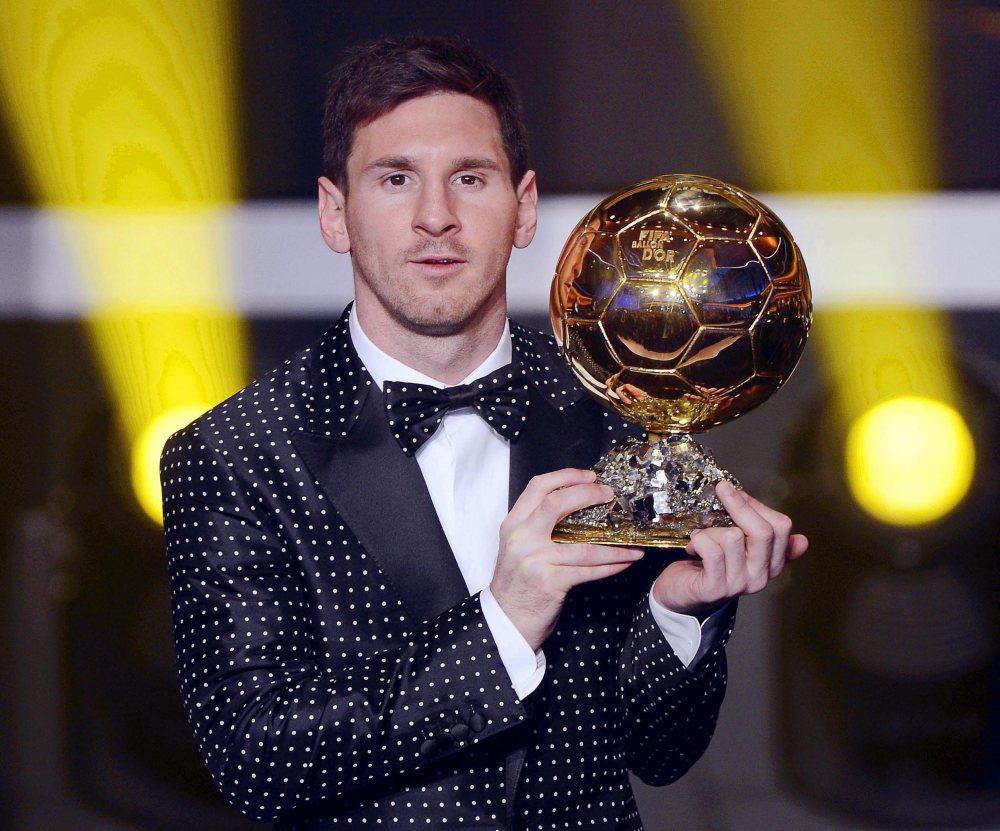 FC Barcelona's Argentinian striker Lionel Messi poses with the trophy after being awarded the FIFA Men's World Player of the Year during the FIFA Ballon d'Or Gala 2012 held at the Kongresshaus in Zurich, Switzerland, Monday, Jan 7, 2013. Messi was...
