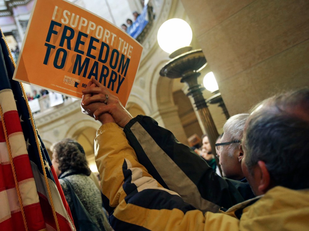 File Photo: In this Feb. 14, 2013 file photo supporters of gay marriage call for Minnesota lawmakers to legalize gay marriage at the State Capitol in St. Paul, Minn. Minnesota has a state House vote on gay marriage Thursday, May 9, 2013, and...