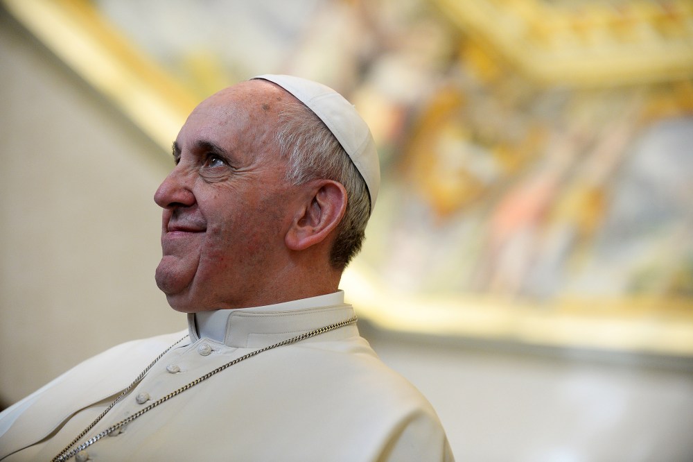Pope Francis smiles as he meets with Cyprus President Nicos Anastasiades during a private audience in the pontiff's studio, at the Vatican, Feb. 15, 2014.