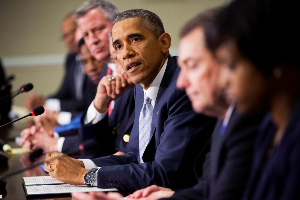 President Barack Obama, center, speaks during his meeting with elected officials, law enforcement officials and community and faith leaders in Washington, D.C., Dec. 1, 2014. (Photo by Pablo Martinez Monsivais/AP)