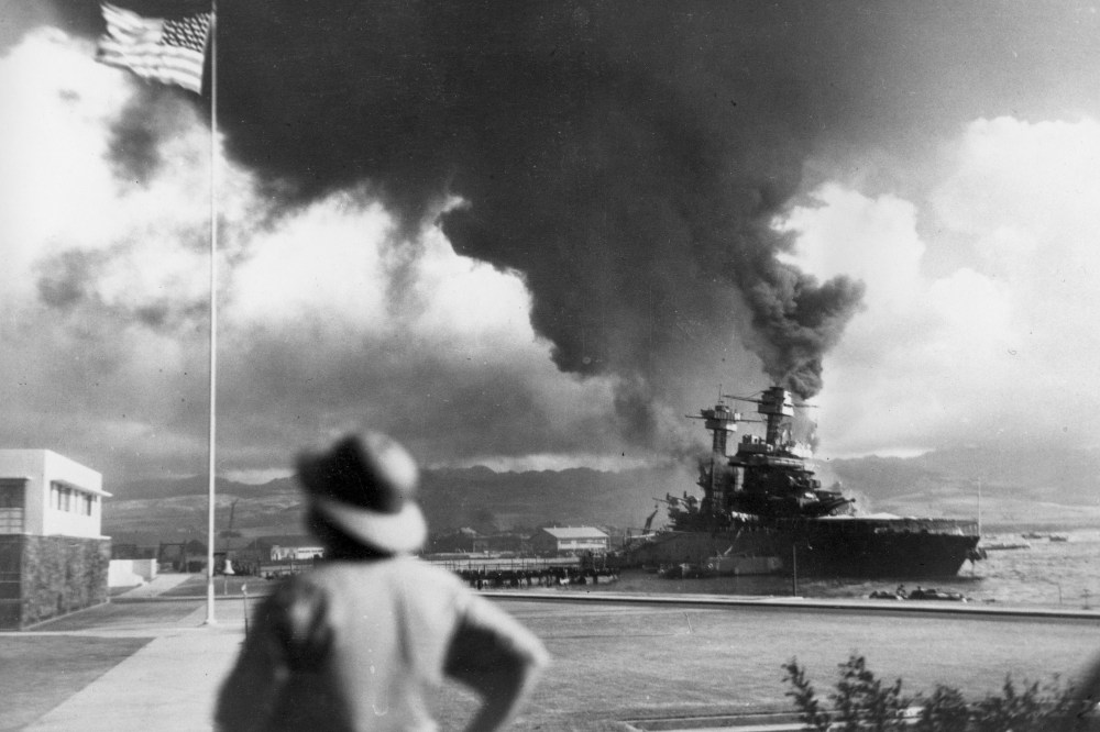 American ships burn during the Japanese attack on Pearl Harbor, Hawaii, on Dec. 7, 1942. (Photo by AP)