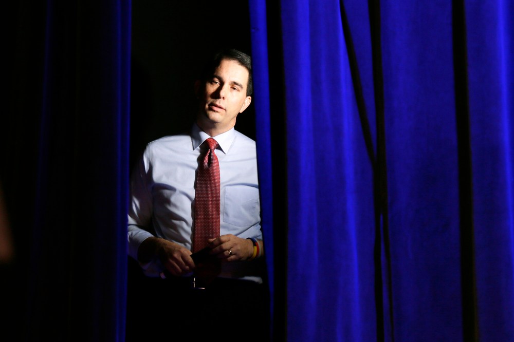 Wisconsin Gov. Scott Walker waits backstage before speaking at the Freedom Summit, Jan. 24, 2015, in Des Moines, Iowa. (Photo by Charlie Neibergall/AP