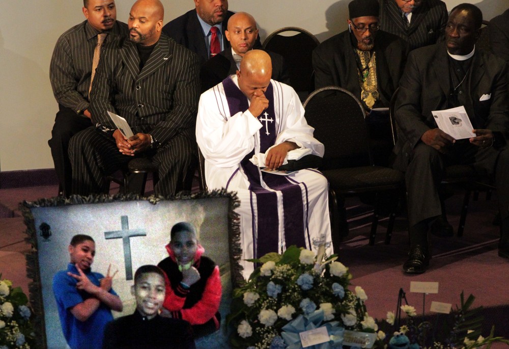 Pastor Henry Currie of Mary B. Wise Baptist Church collects himself during services for Tamir Rice, in Willoughby, Ohio, Dec. 3, 2014. (Photo by The Plain Dealer, Lynn Ischay/AP)