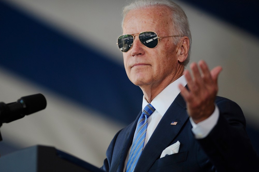 Vice President Joe Biden gestures after donning a pair of sunglasses as he delivers the Class Day Address at Yale University on May 17, 2015, in New Haven, Conn. (Photo by Jessica Hill/AP)