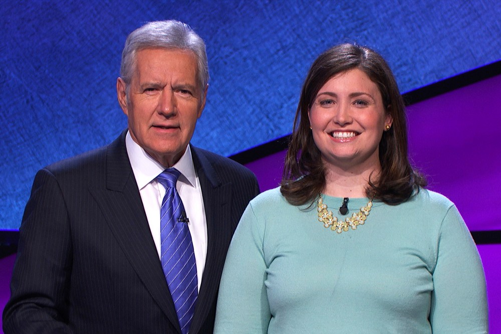 Alex Trebek poses with "Jeopardy!" contestant Julia Collins, January 2014.
