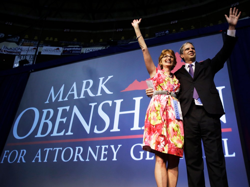 State Sen. Mark Obenshain waves to the crowd with his wife, Suzanne at the Virginia Republican convention, May 18, 2013.