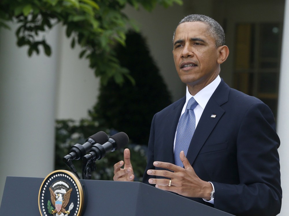 President Barack Obama gestures during the joint news conference with Turkish Prime Minister Recep Tayyip Erdogan, Thursday, May 16, 2013, in the Rose Garden of the White House in Washington. (Photo by Charles Dharapak/AP Photo)