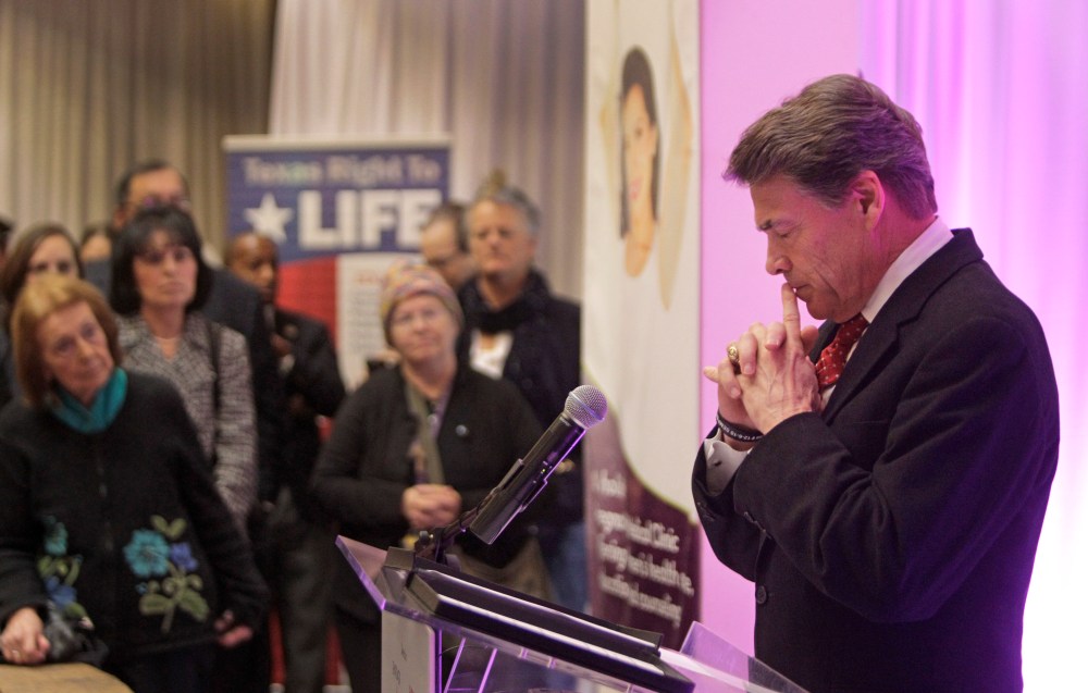 Governor Rick Perry pauses as he speaks during media conference at The Source for Women, Tuesday, Dec. 11, 2012, in Houston. (AP Photo/Houston Chronicle, Melissa Phillip)