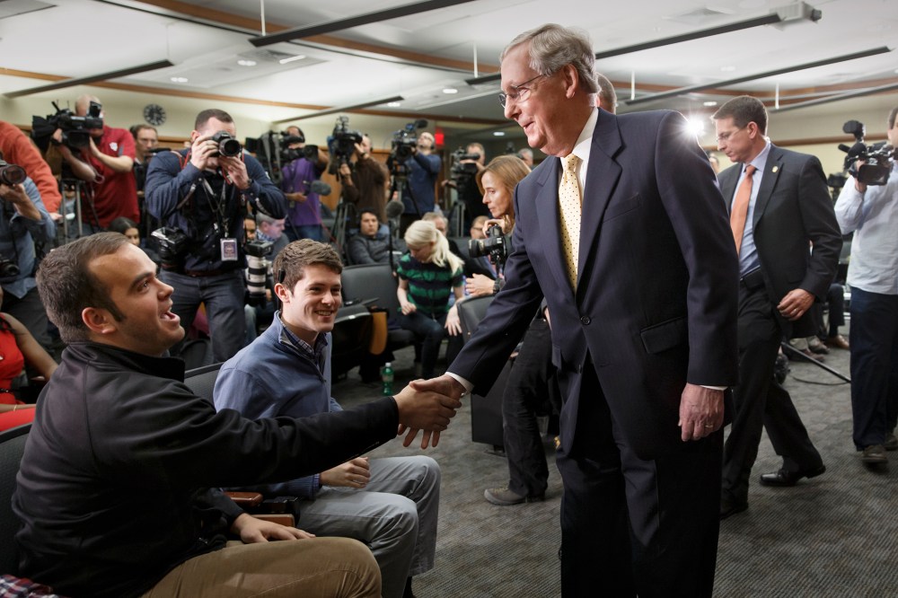 Senate Republican leader Mitch McConnell of Kentucky shakes hands with students at the University of Louisville's McConnell Center for political studies on Nov. 5, 2014. (J. Scott Applewhite/AP)