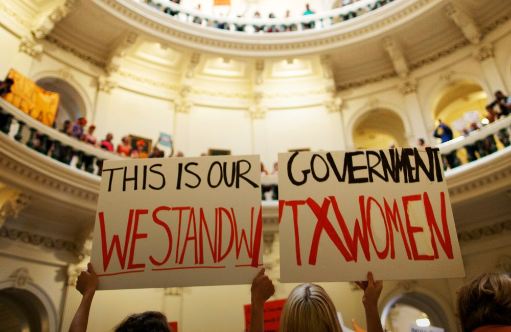 In this July 12, 2013 file photo, abortion rights supporters rally on the floor of the State Capitol rotunda in Austin, Texas.